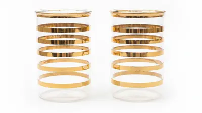 Gold bands on glass tumblers